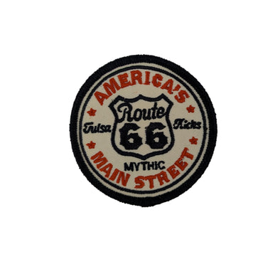 Round patch with 'America's Route 66 Main Street Mythic' text on a white background